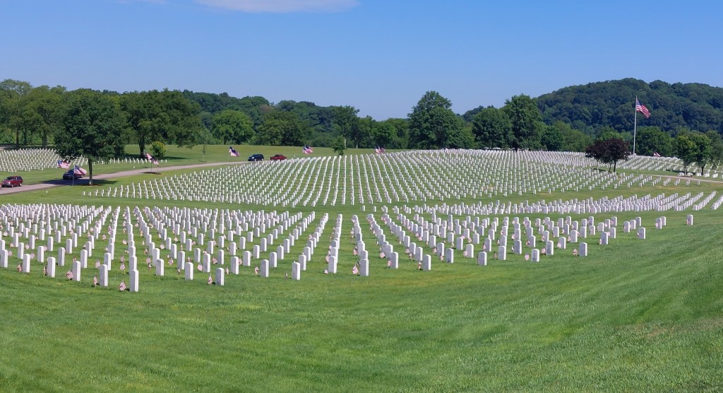 Flags placed in front of tombstones at Middle Tennessee Veterans Cemetery.